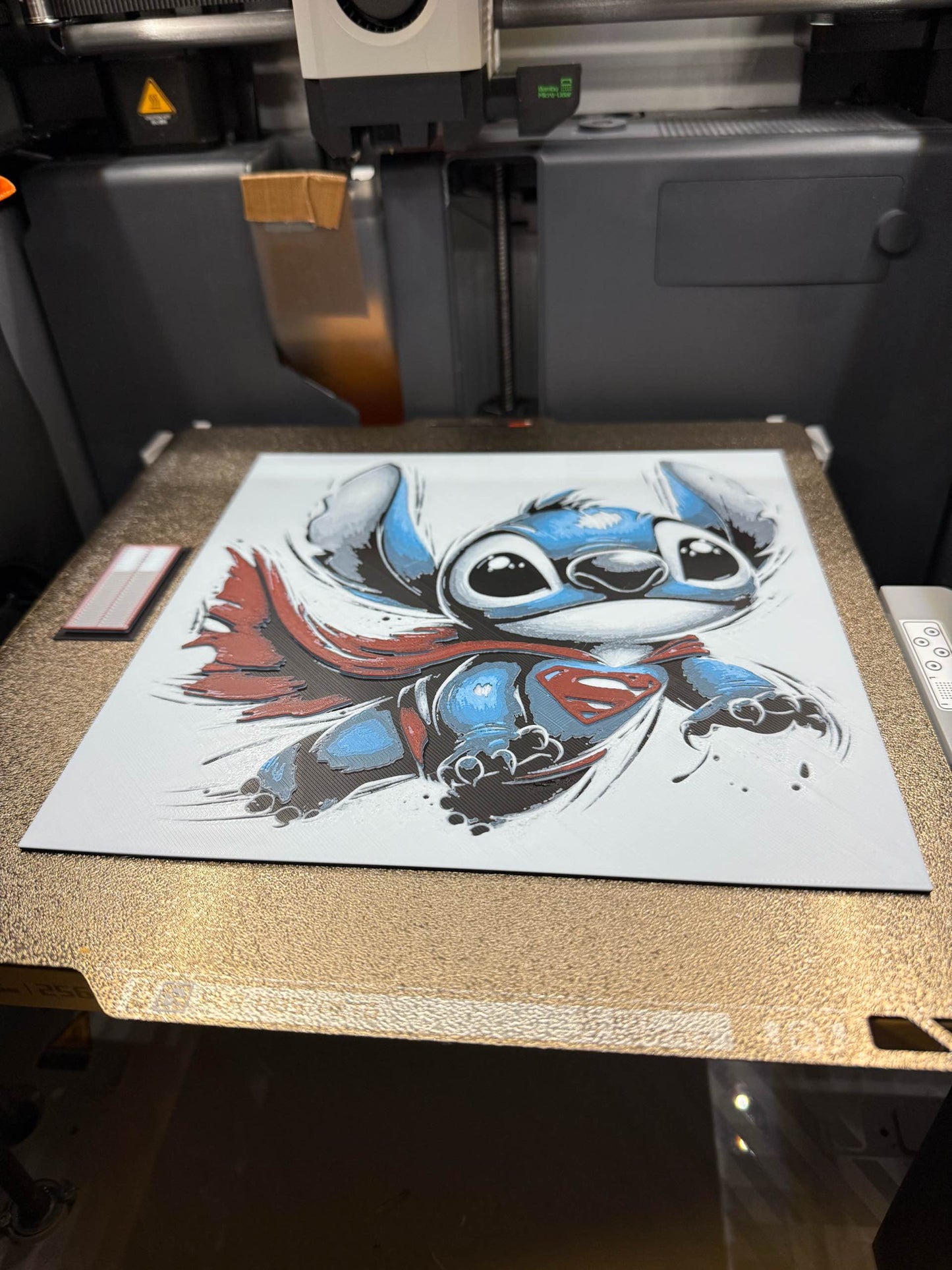 Stitch Dressed as Superman – HueForge 12″×12″ 3D Printed Wall Art